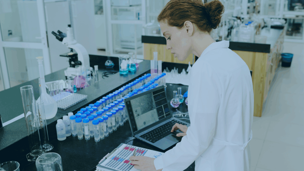 Clinical lab tech at computer